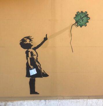 murale bansky acilia ritoccata opera